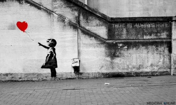 MEDICINA ONLINE artista di strada Banksy girl love ballon heart graffiti muri murales bambina palloncino cuore amore poesia non corrisposto gioco di sguardi innamorati coppia fidanzati matrimoni sposati divorzio separazione.jpg